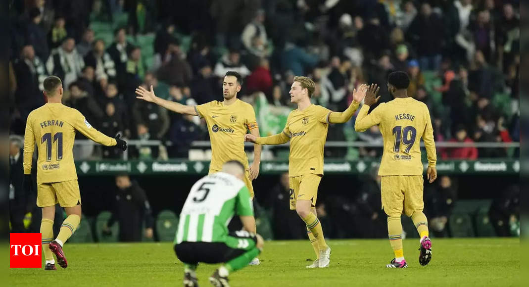 Barcelona earn tense win at Betis to extend La Liga lead | Football News – Times of India