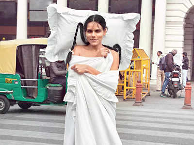 Artist beats Delhi chill with blanket & pillow, but in street style