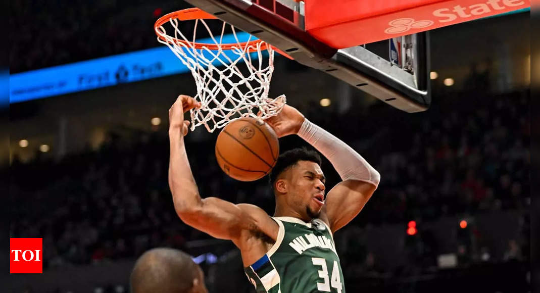 Portland Trail Blazers' Josh Hart (11) shoots over Milwaukee Bucks