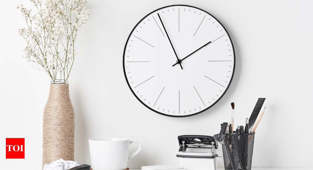 Premium Photo  Stylish wall clock on white background