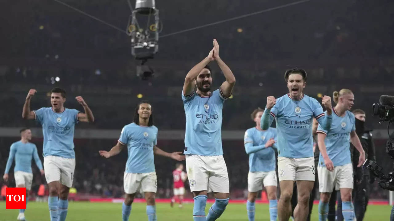 Slick Manchester City sink Arsenal to seize top spot in title race