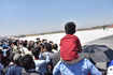 Children enjoy the display at the 14th edition of Aero India