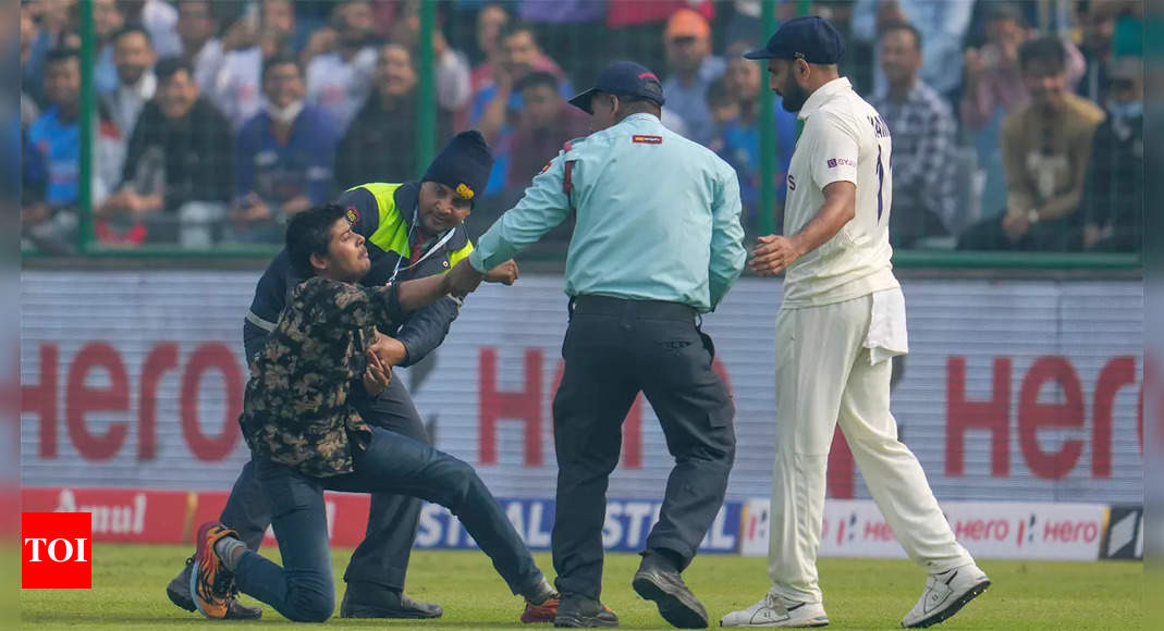 Watch: Mohammed Shami rescues pitch invader, wins hearts | Cricket News – Times of India