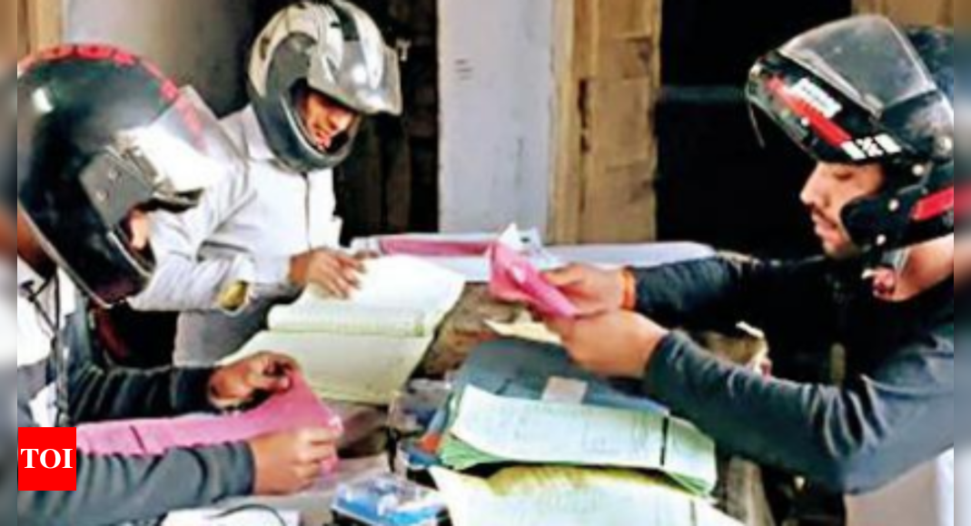 With roof crumbling, discom staff in UP town work with helmets on | India News – Times of India