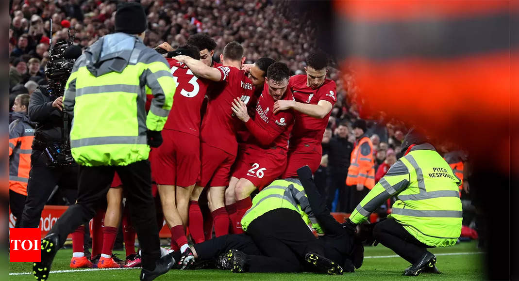 Liverpool to ban pitch invader who nearly injured Robertson | Football News – Times of India
