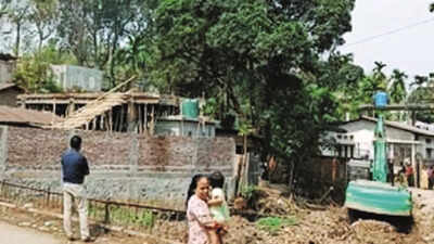 Guwahati: GMC razes private properties blocking flow of Bahini river