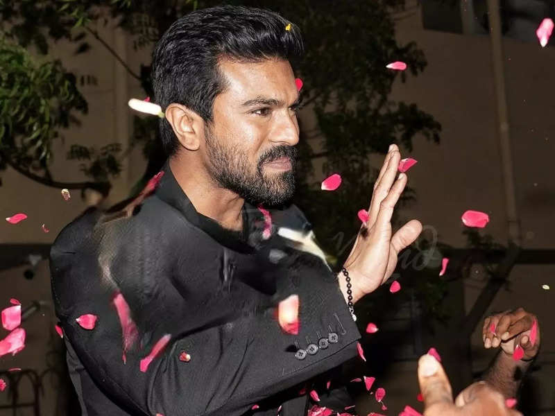 Video: Ram Charan showered with flower petals on his arrival in Hyderabad