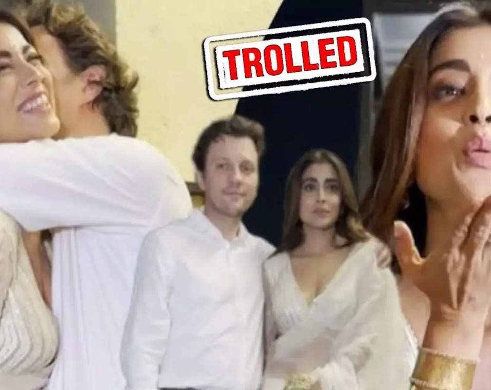 
PDA Alert! Shriya Saran's husband kisses her while posing for paparazzi at 'Kabzaa' screening; TROLLS say 'bhai teri hi biwi hai'

