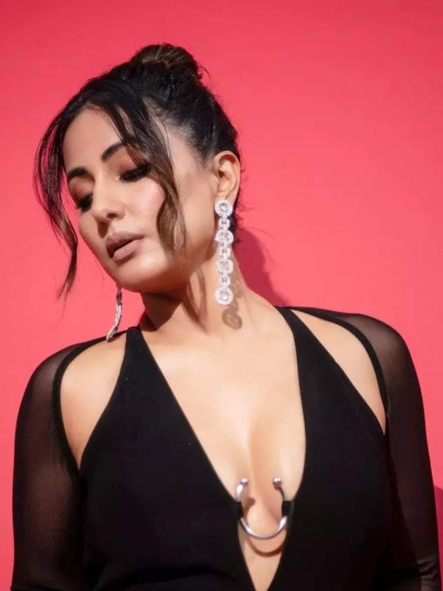 Hina Khan sets the red carpet on fire in a black slit gown with an underbust accessory