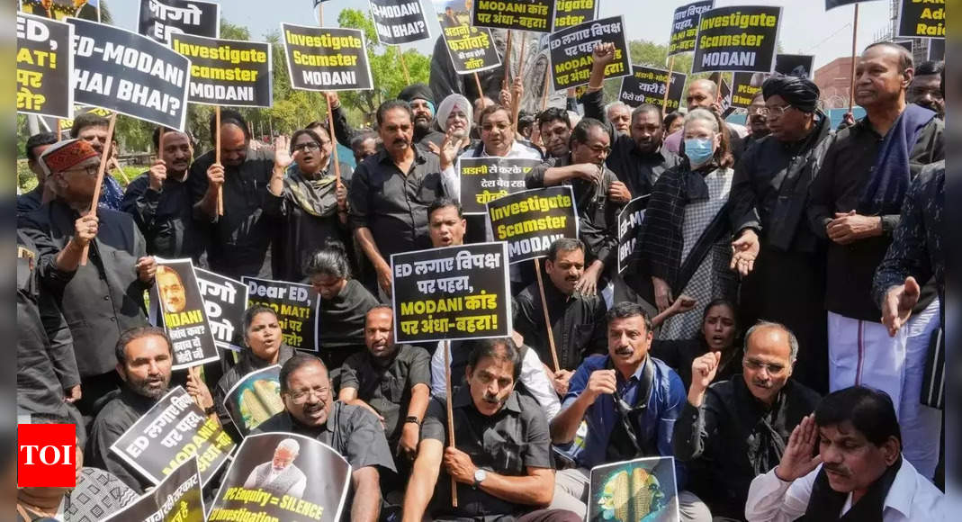 Dressed in black, opposition MPs stage protest over Adani issue, Rahul Gandhi's disqualification - timesofindia.com