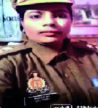 SI gives uniform to a woman to make reel, gets suspended