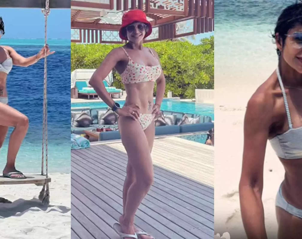 
50-year-old Mandira Bedi flaunts her toned abs in different bikinis, drops stunning video from Maldives vacation
