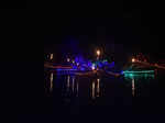 Boats and torches light up the river at COEP's Regatta