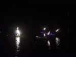 Boats and torches light up the river at COEP's Regatta