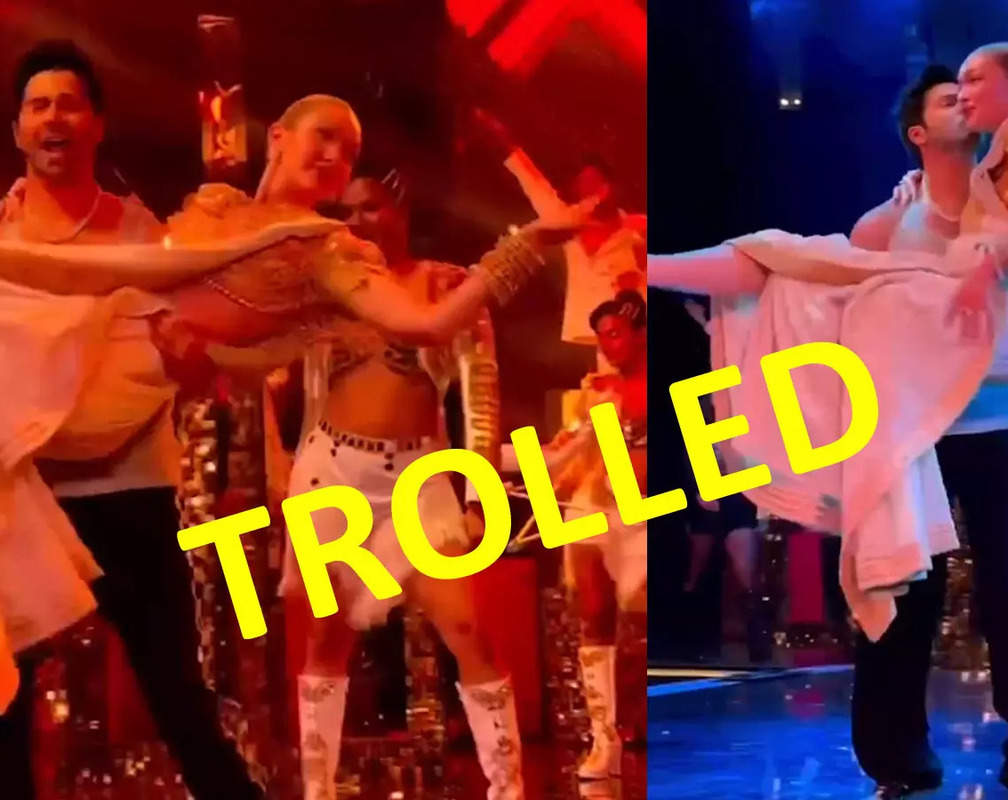 
TROLLED! Varun Dhawan lifts Gigi Hadid and gives her a peck on the cheek during his dance performance; netizens call it 'cheap', 'highly inappropriate'
