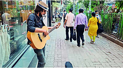 After Covid bar job loss, musician finds audience on Park St pavement