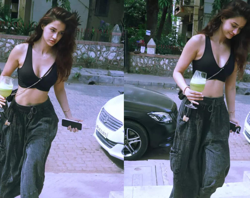 
Disha Patani flaunts her envious physique in a black top with deep neckline
