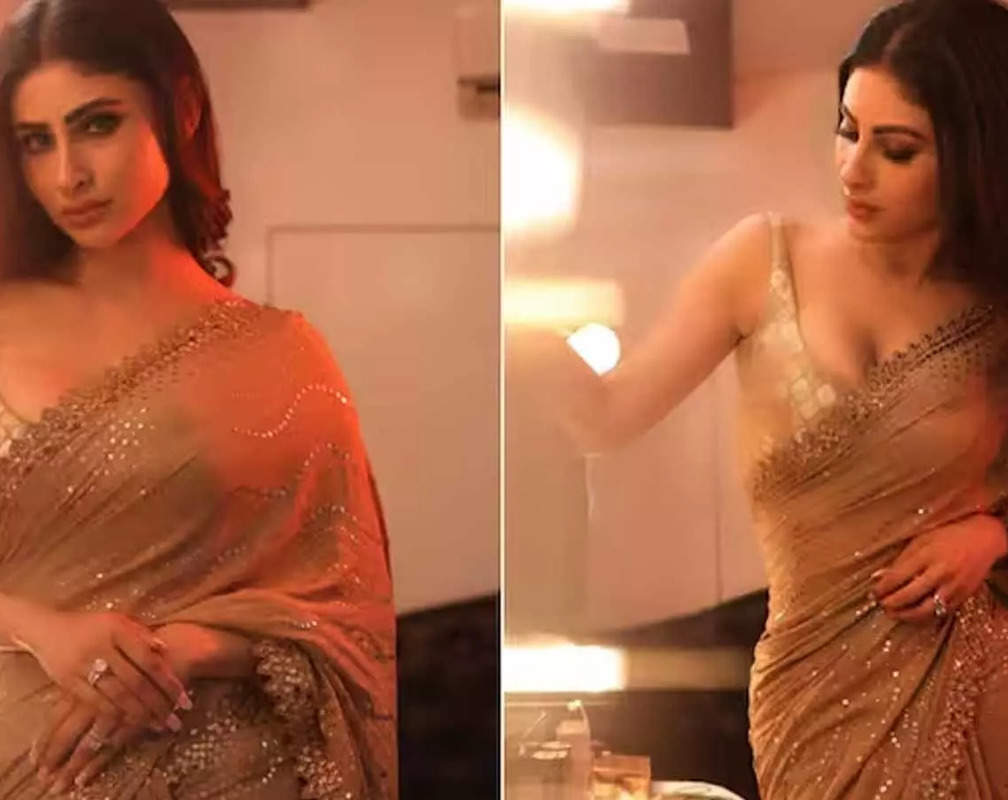 
Mouni Roy channels her inner diva in glittery golden saree, flaunts her svelte figure
