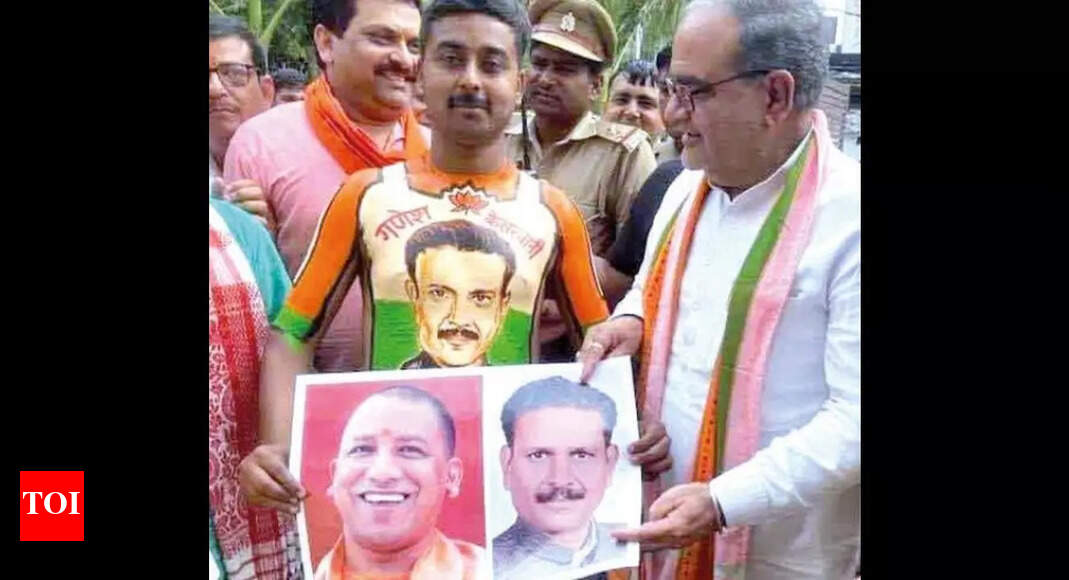 BJP worker campaigns with portraits of UP CM Yogi Adityanath, poll ...