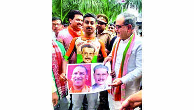 BJP worker canvassing with portraits of CM & party’s mayoral candidate painted on his body