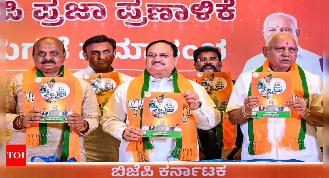 BJP’s Karnataka poll manifesto promises UCC, NRC; freebies for BPL families | India News – Times of India