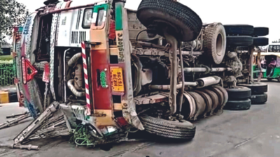 In Greater Noida, overloaded truck taking turn flips, 25-year-old helper dies