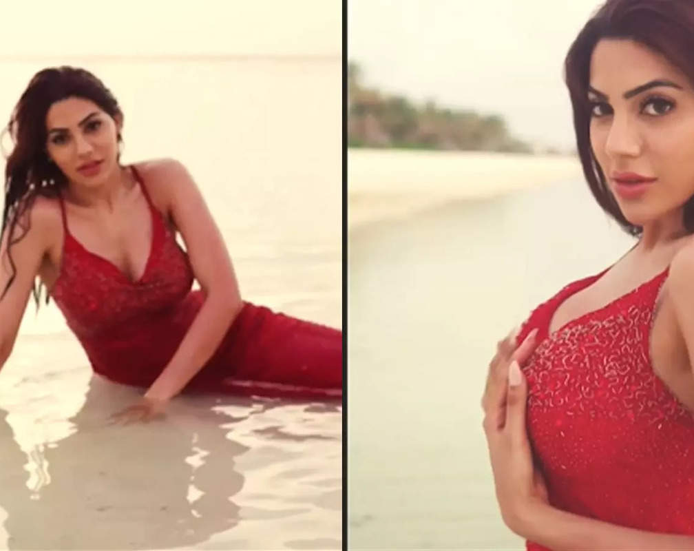 
Watch: 'Jalpari' Nikki Tamboli takes a dip in the sea dressed in a gorgeous red gown
