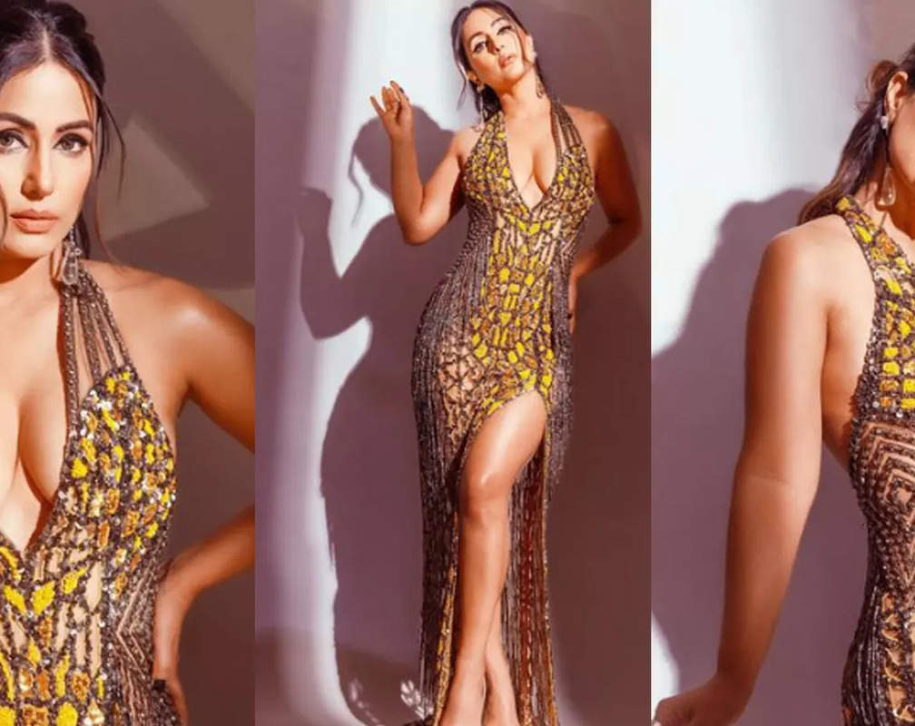 
Hina Khan flaunts her curves in yellow gown with thigh-high slit and deep plunging neckline

