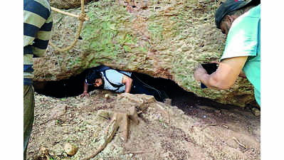 Historians discover man-made cave in grove at foothills of Pawangad fort