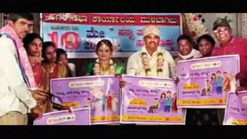 Karnataka assembly elections: Bride, groom display placards on voting