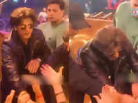 Shah Rukh Khan's security helps the actor after fans didn't let go of his hand