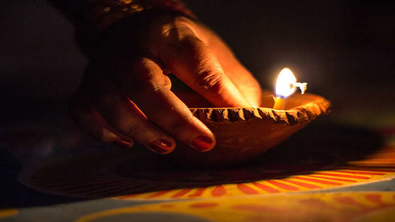 Young teenager girl celebrating diwali in Indian saree with diwali diya(oil  lamp). Diwali is biggest festival of India. Diwali is festival of lights  and happiness. Stock Photo | Adobe Stock