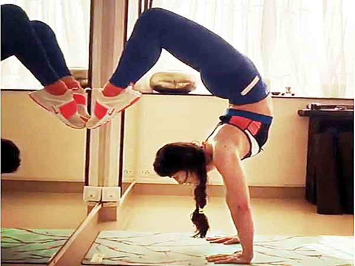 HEELS OVER HEAD: Is going upside down the celebrity fave fitness pose on  Instagram? - Times of India