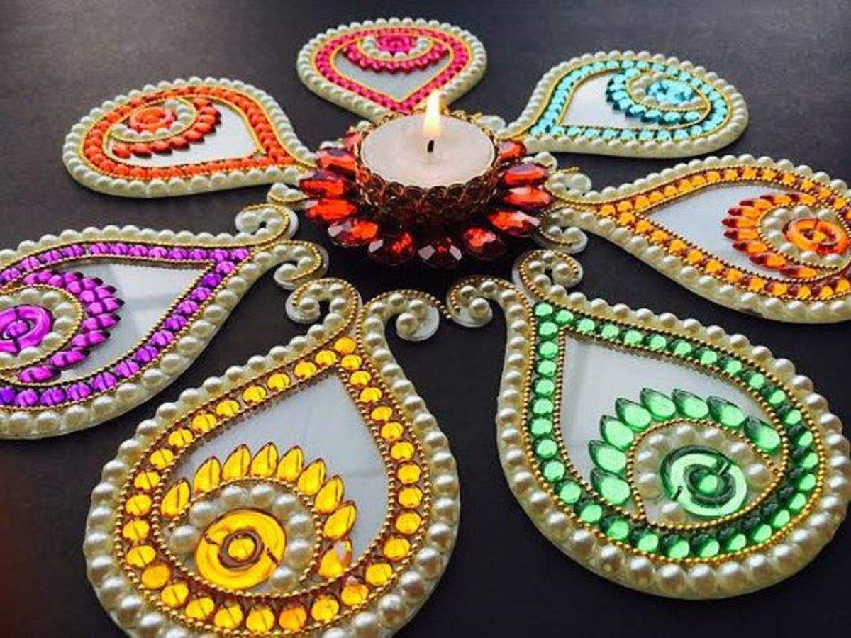 Unique rangoli designs for Diwali: Try making a mirror rangoli ...