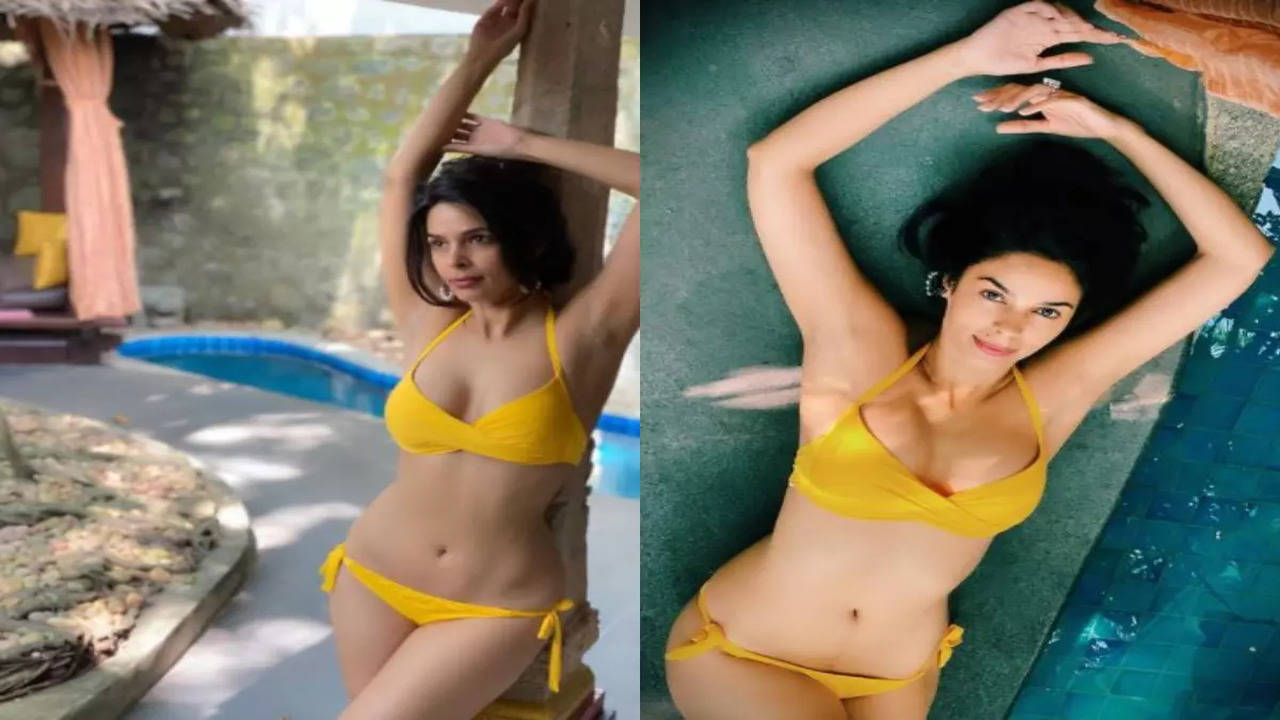 Pics Mallika Sherawat marks her 45th birthday wearing a yellow bikini and posing by the pool Hindi Movie News