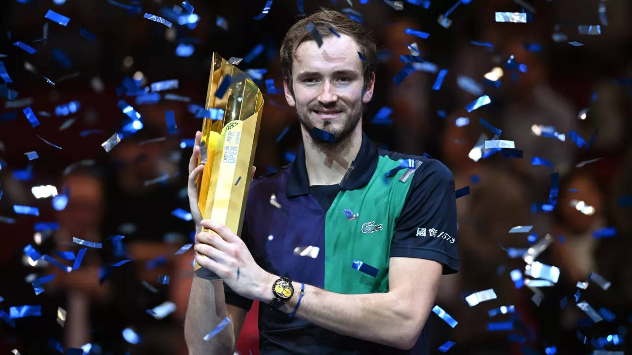 Daniil Medvedev of Russia, right, poses after winning the final