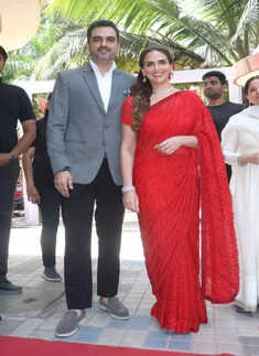 Esha Deol stuns in a red saree at the launch of a jewellery store