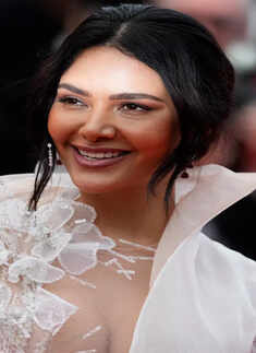 ​Esha Gupta debuts at Cannes in a floaty white gown with a thigh-high slit​