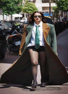 Surveen Chawla casts a spell in an oversized trench coat and black shorts