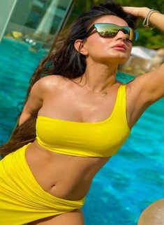 Ameesha Patel oozes oomph in stylish swimwear