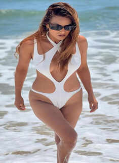 Nia Sharma aces the cutout trend in chic white monokini as she enjoys beach vacay