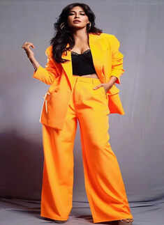 Chitrangda Singh nails boardroom fashion in chic tangerine pantsuit
