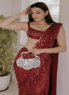 Kajal Aggarwal paints the town red in dazzling saree and flower-shaped statement purse