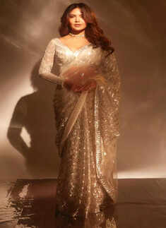 Esha Gupta looks dreamy in a silver sequined saree