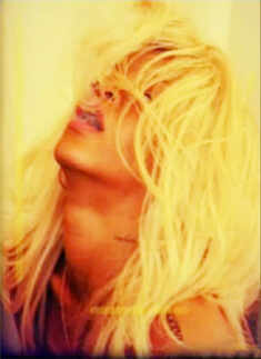 Rihanna strips for 'Nude' fragrance!