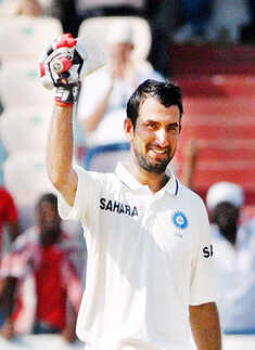 Pujara scores maiden Test ton