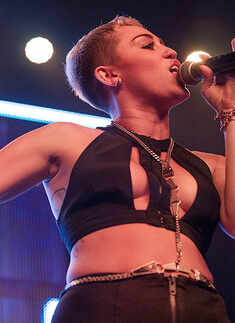 Miley Cyrus dances with stripper