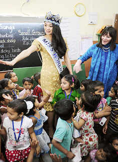 Vanya visits school with Miss World