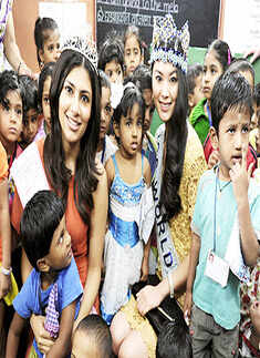 Vanya visits school with Miss World
