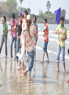 Judi Shekoni in skimpy outfit on Mumbai beach